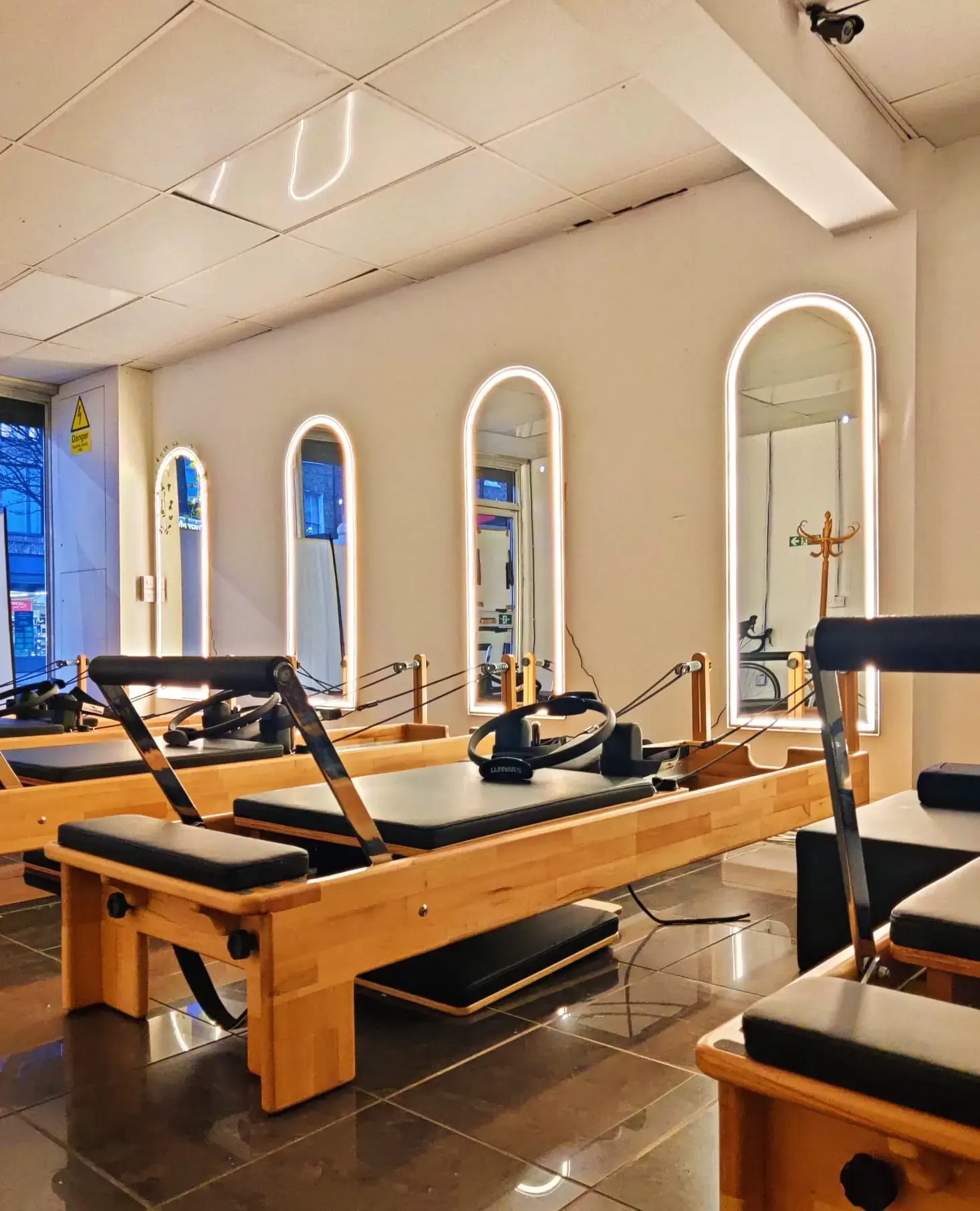 Energie Wellness Centre's modern Reformer Pilates studio with arched mirrors in London